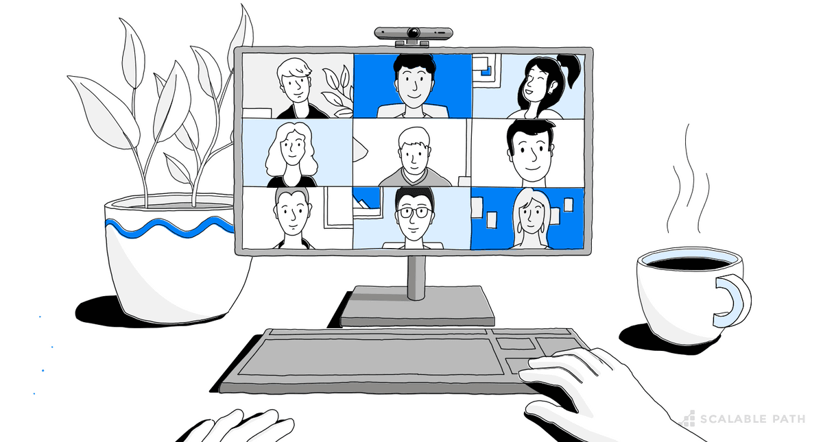 A computer in a desktop with a remote team conected in a video call