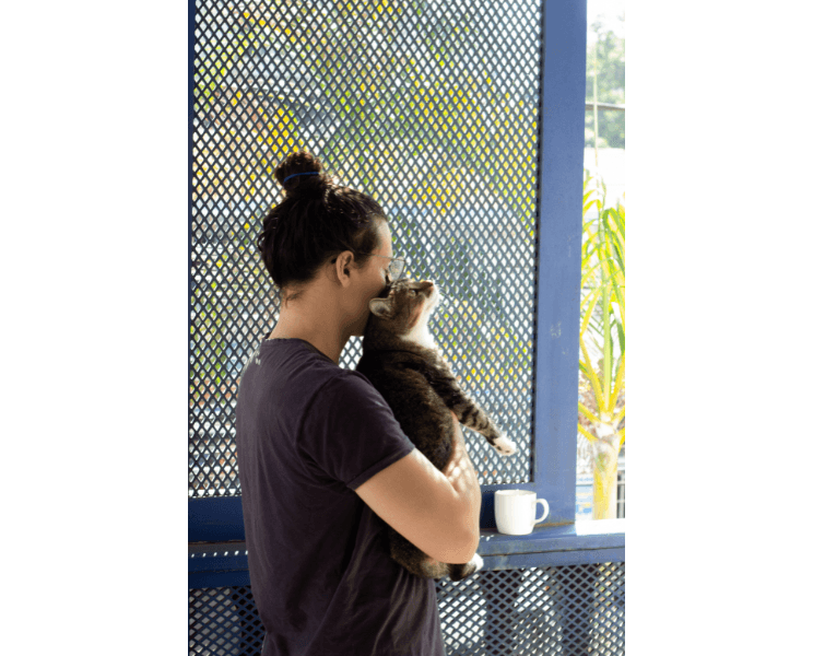Image of Luiz holding his pet cat 